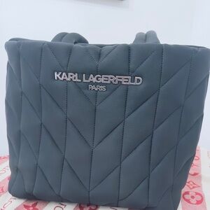 The product is a KARL LAGERFELD PARIS Voyage Large Quilted Tote